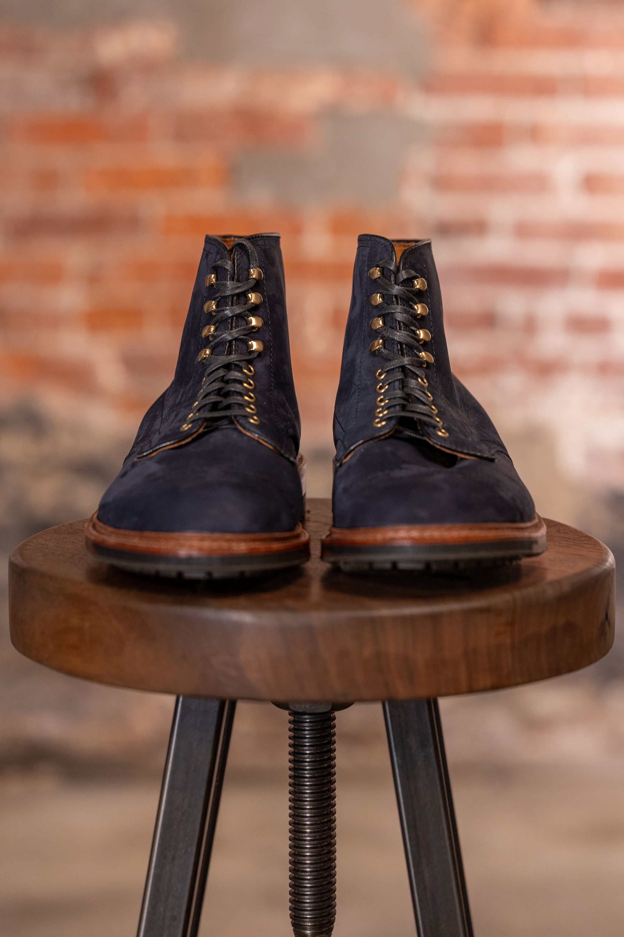 Navy blue suede cap toe boots front view