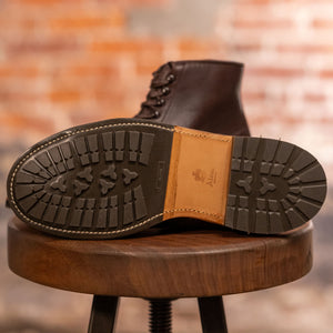 Brown leather cap toe boots view of traction on sole