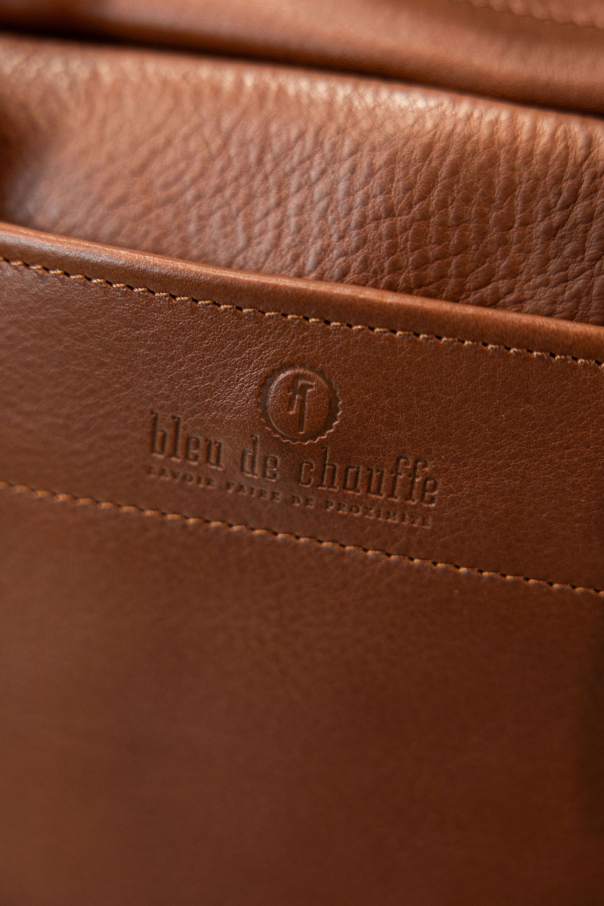 Bleu de Chauffe Folder Business Bag - Amber Brown. detail shot of label