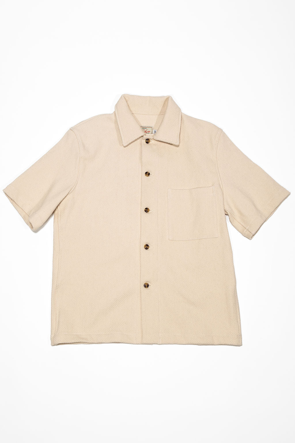 Dehen 1920 Lounge Shirt - Natural Sashi-Ori. laid on back