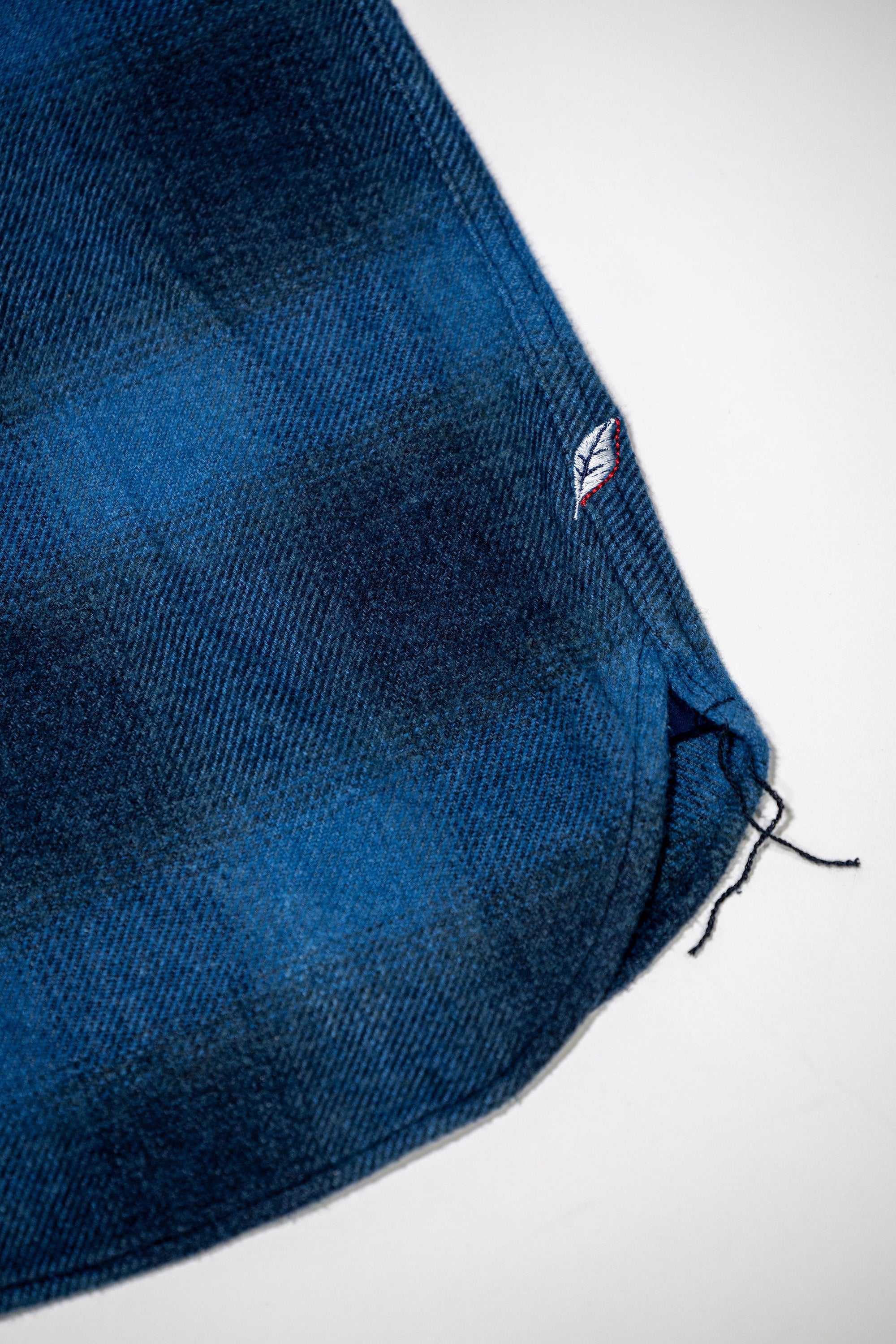 Pure Blue Japan 2235-BE Tweed Check  Shirt - Beige Indigo Overdye. close up of bottom hemming detail
