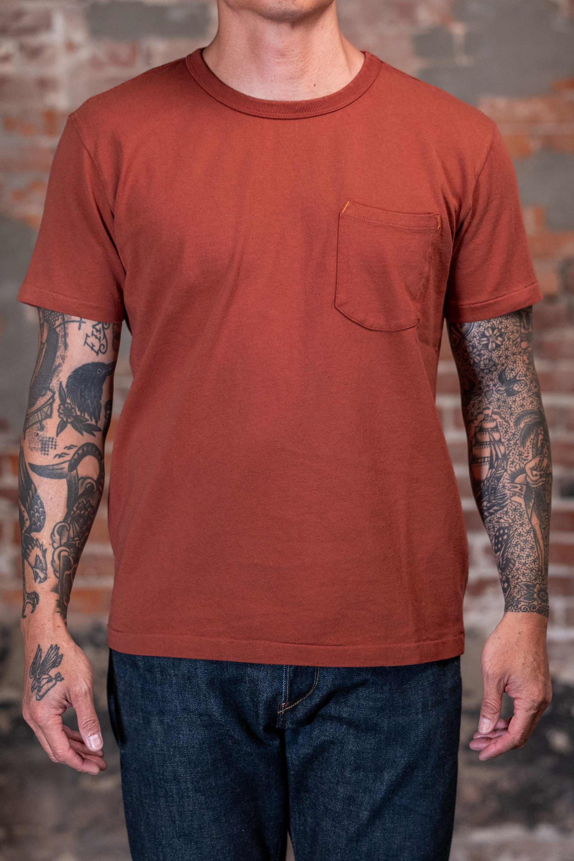 Front view of a man wearing the Freenote Cloth 13oz Pocket T-Shirt in Picante 