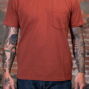 Front view of a man wearing the Freenote Cloth 13oz Pocket T-Shirt in Picante 