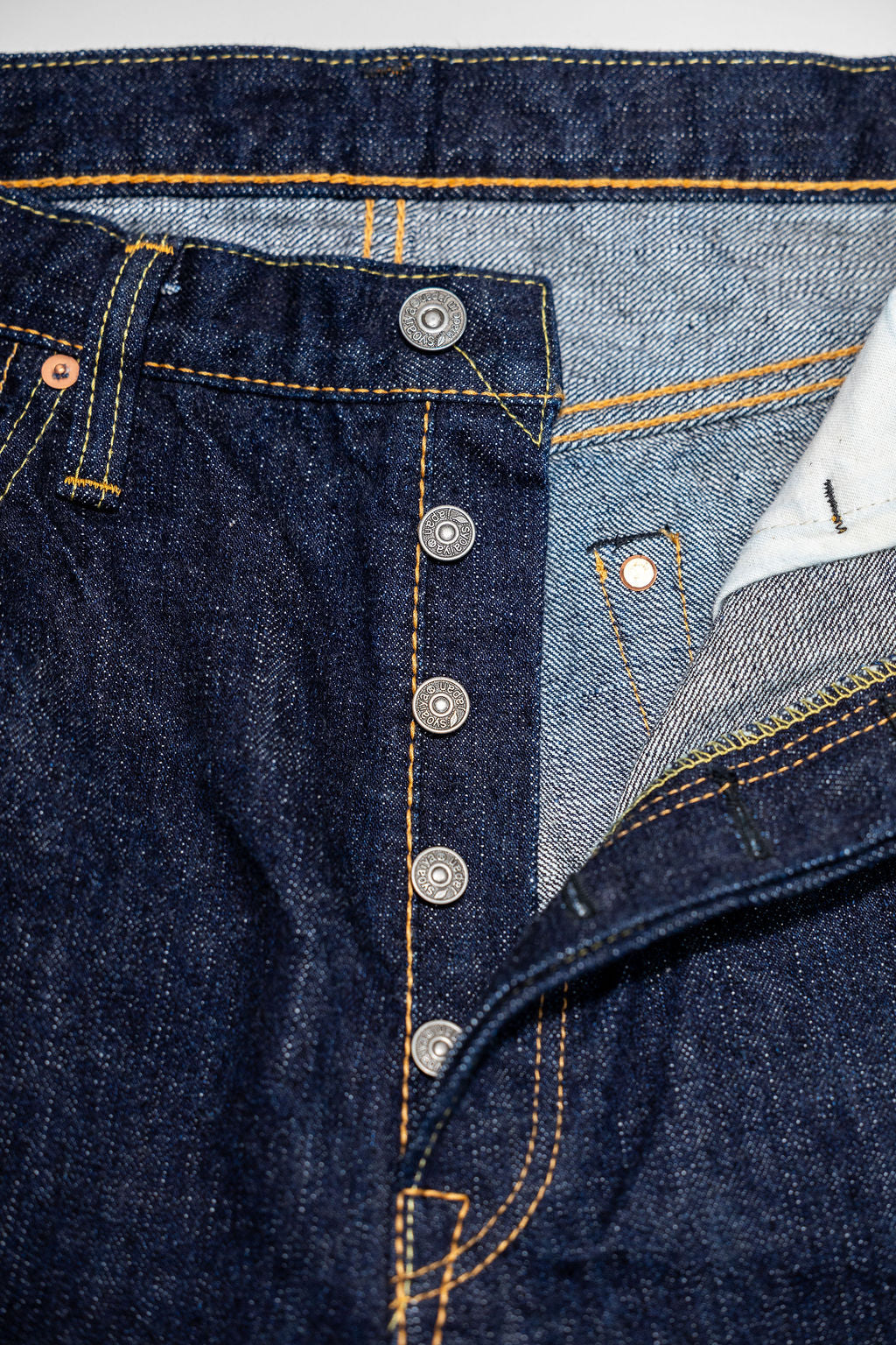 Pure Blue Japan XX-002 Piped Straight - Indigo. close up of buttons