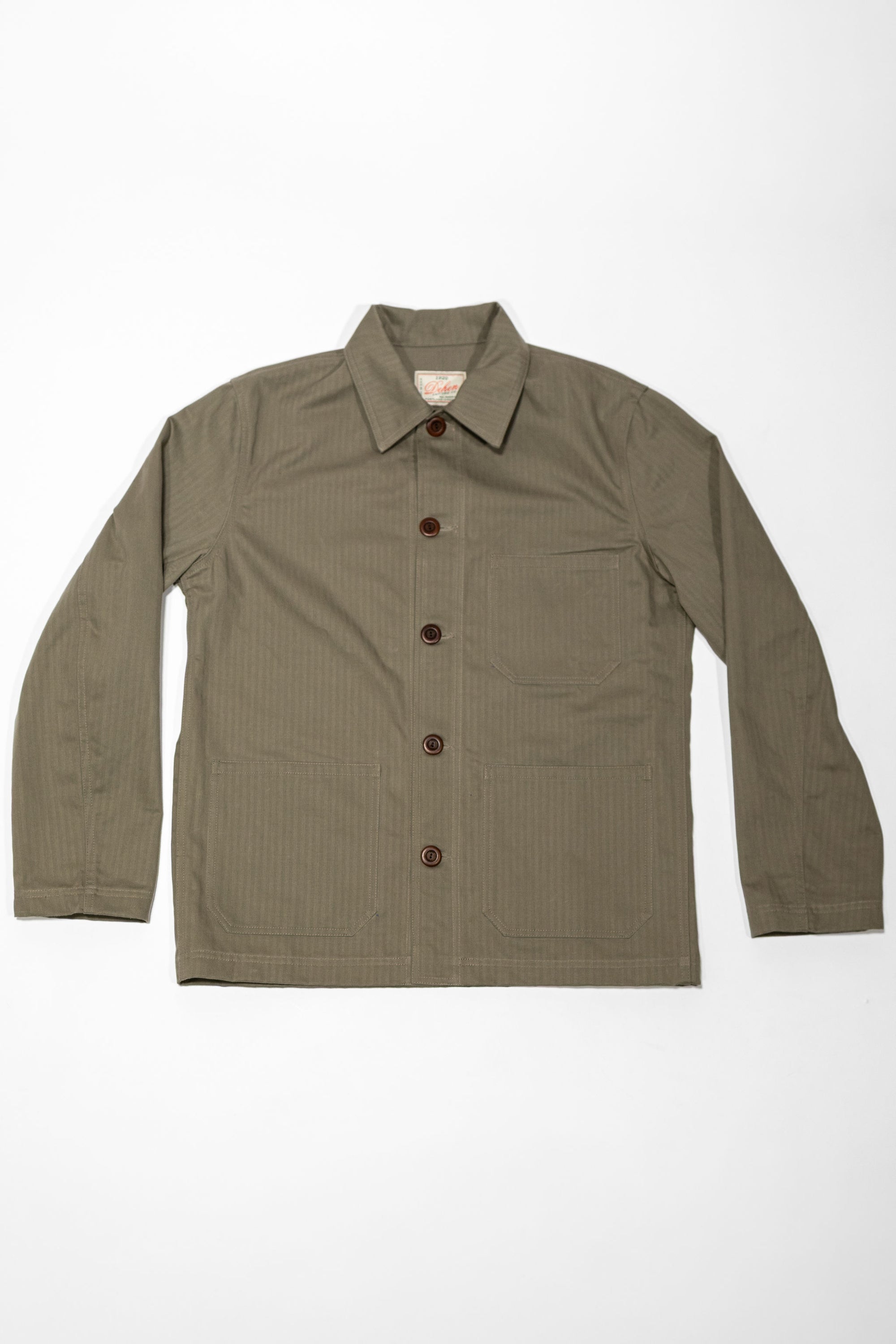 Dehen 1920 Chore Coat - Sage Dry Waxed Cotton. laid on back