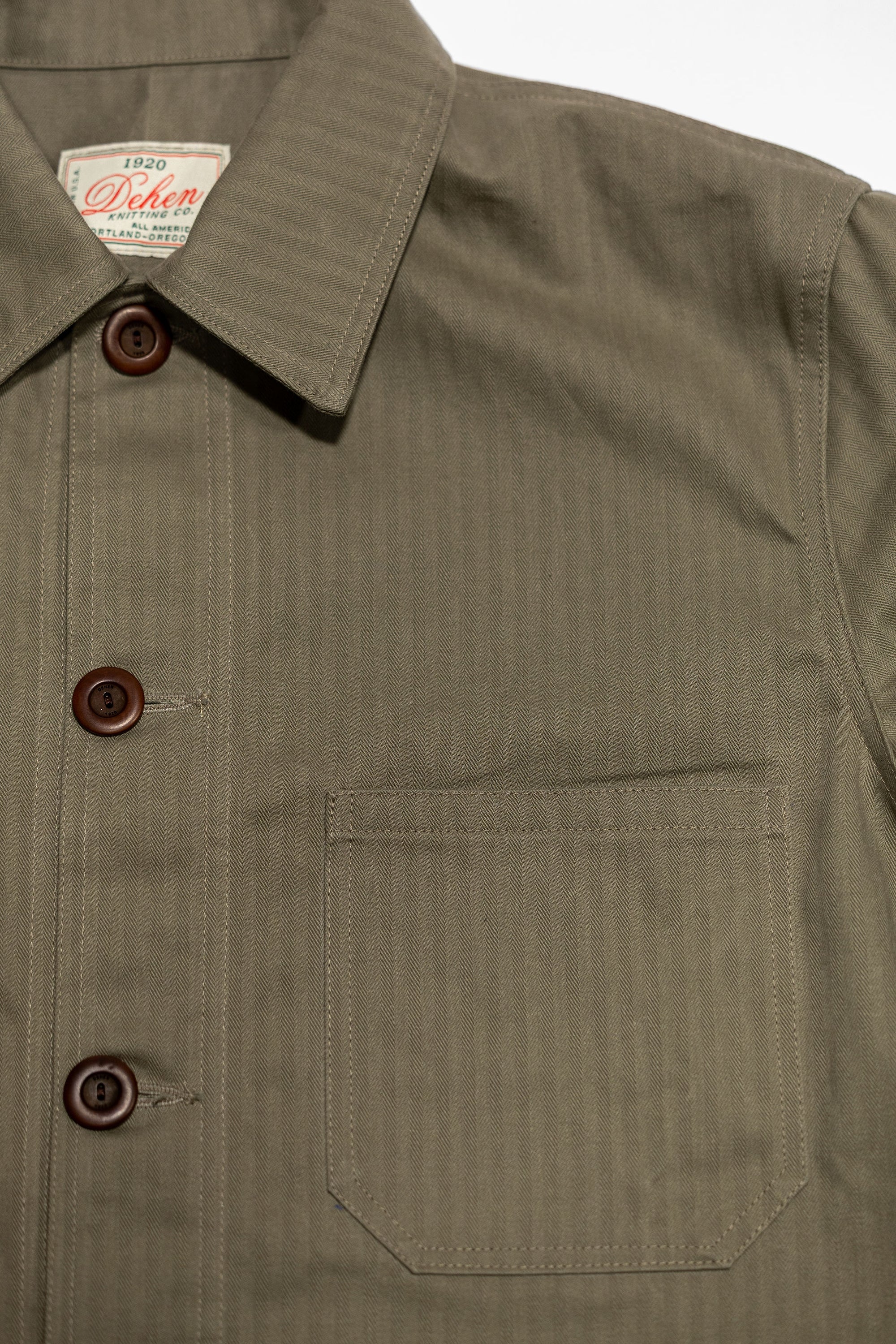 Dehen 1920 Chore Coat - Sage Dry Waxed Cotton. close up of front pocket detail