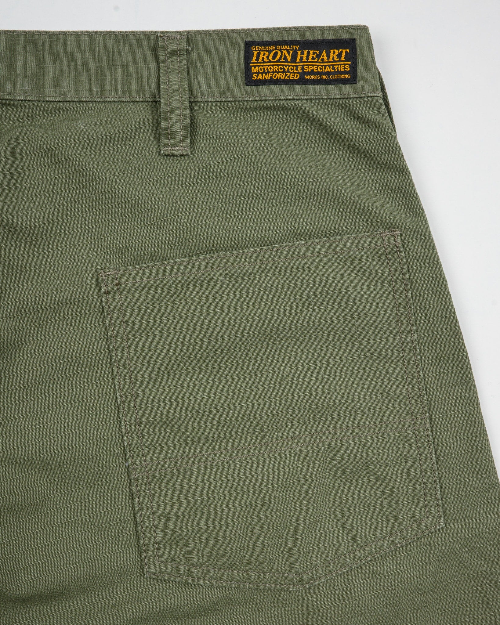Olive pants back view laying flat closeup on pocket