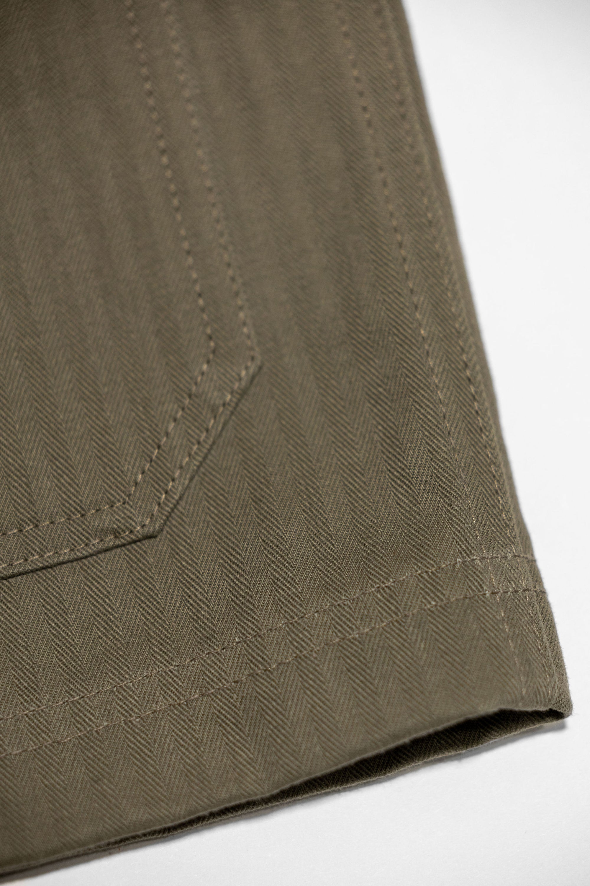 Dehen 1920 Chore Coat - Sage Dry Waxed Cotton. close up of fabric detail
