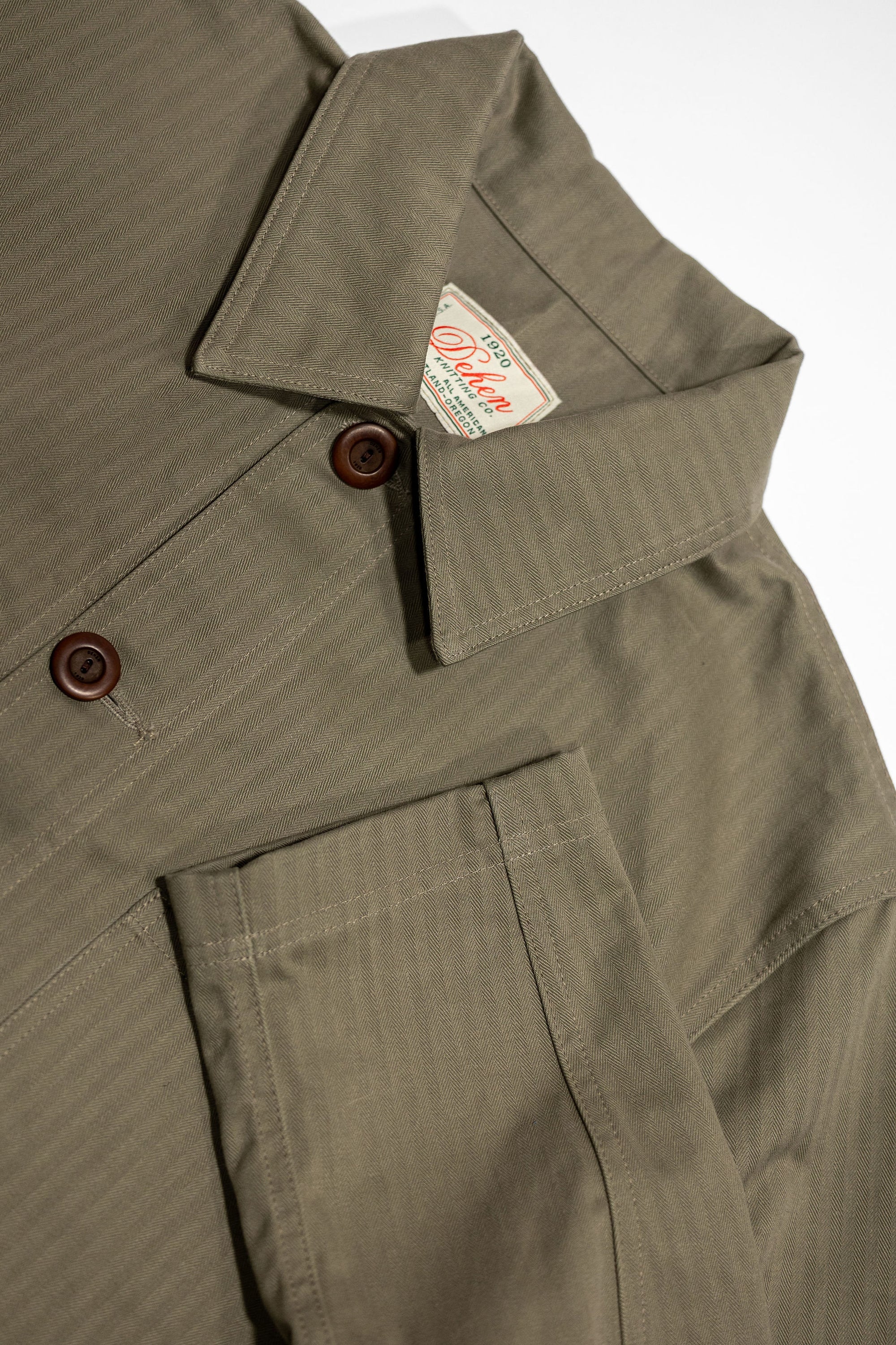 Dehen 1920 Chore Coat - Sage Dry Waxed Cotton. close up of sleeve detail