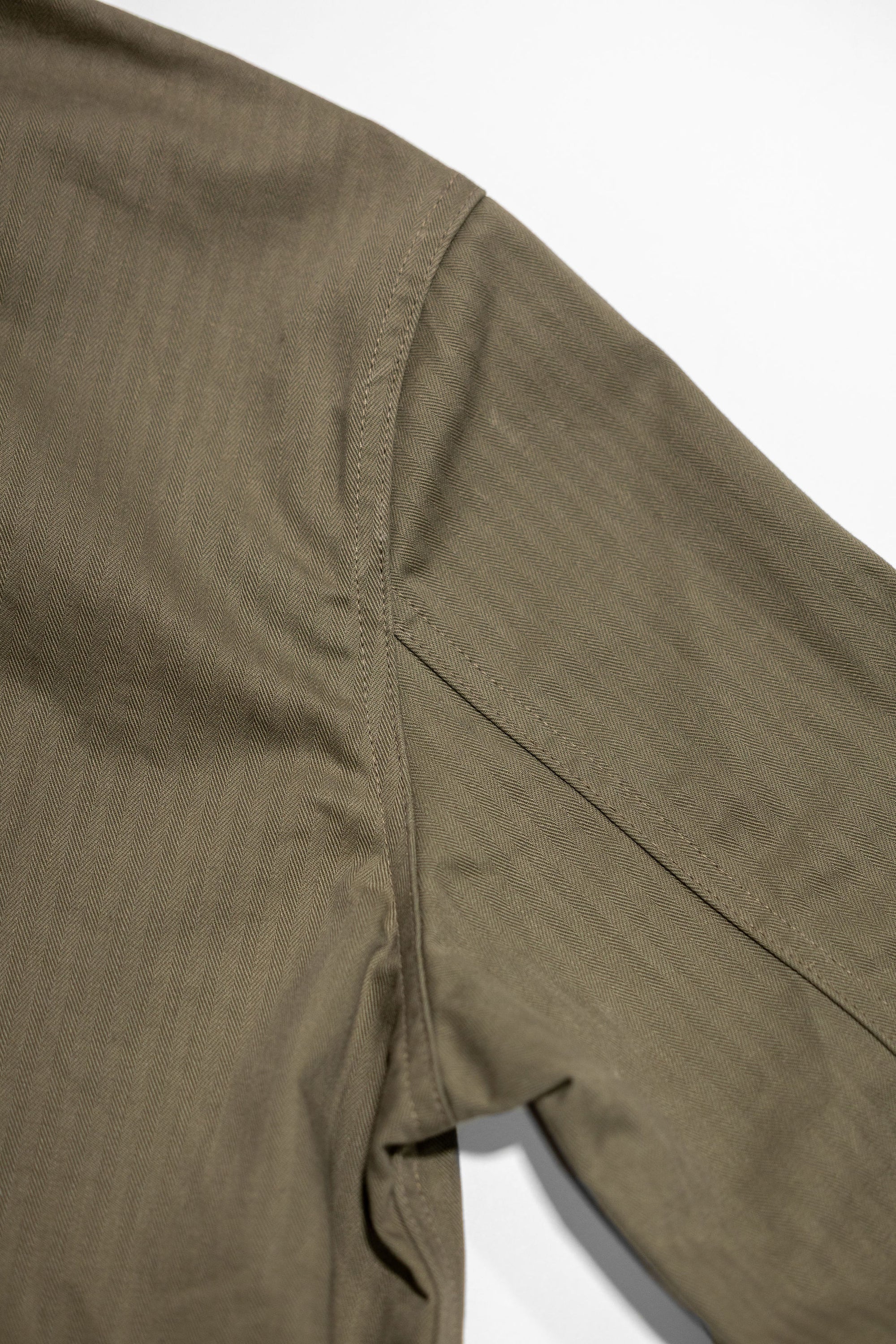 Dehen 1920 Chore Coat - Sage Dry Waxed Cotton. close up of shoulder detail