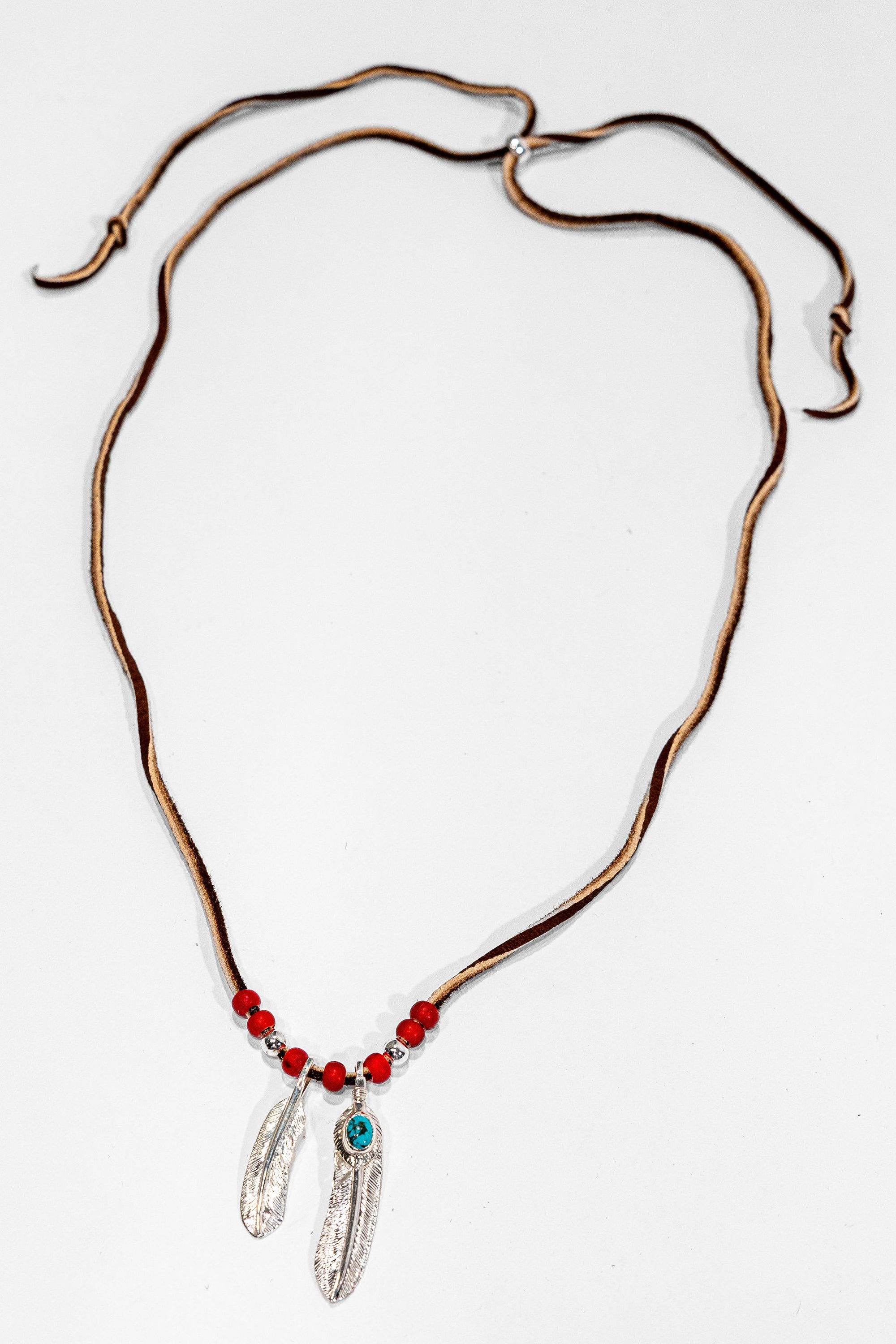 First Arrow’s Deerskin Leather Beaded Necklace Set - Feather and Heart-feather Pendants
