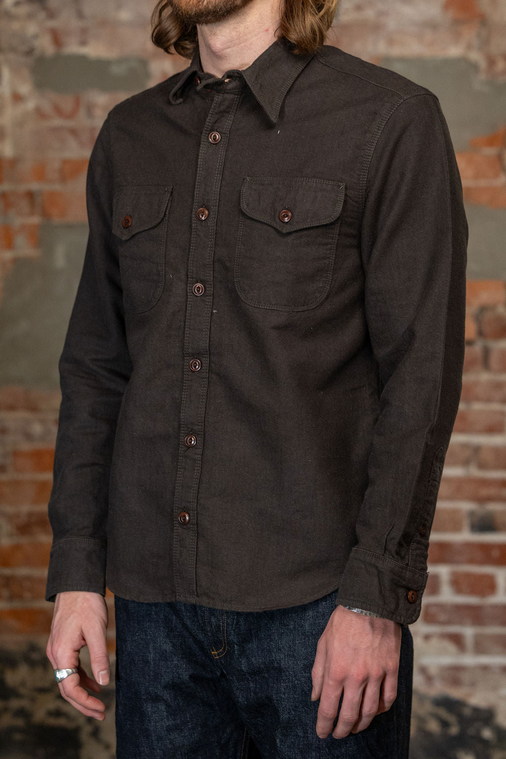 Wells shirt on model. Facing side. 