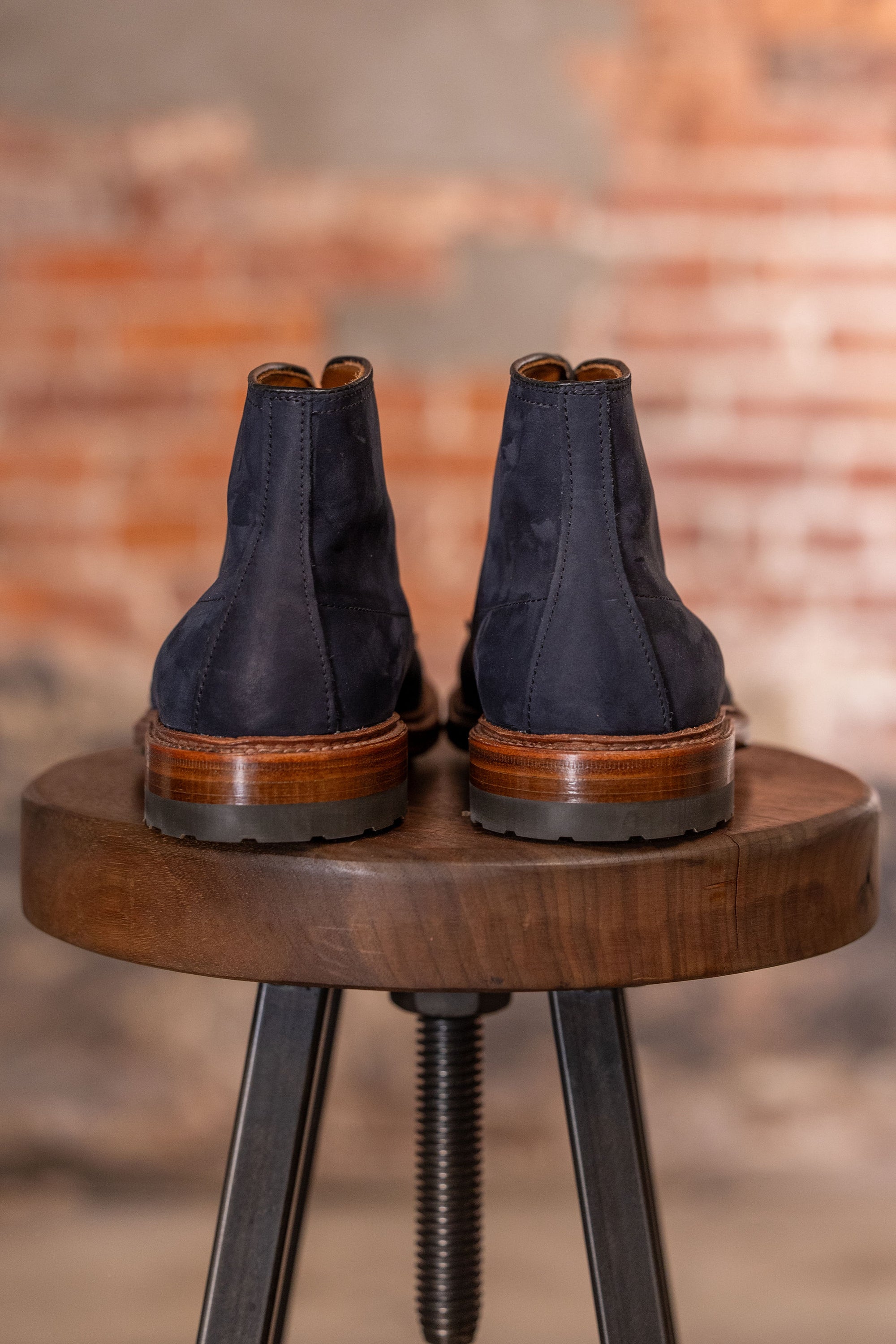 Navy blue suede cap toe boots back view