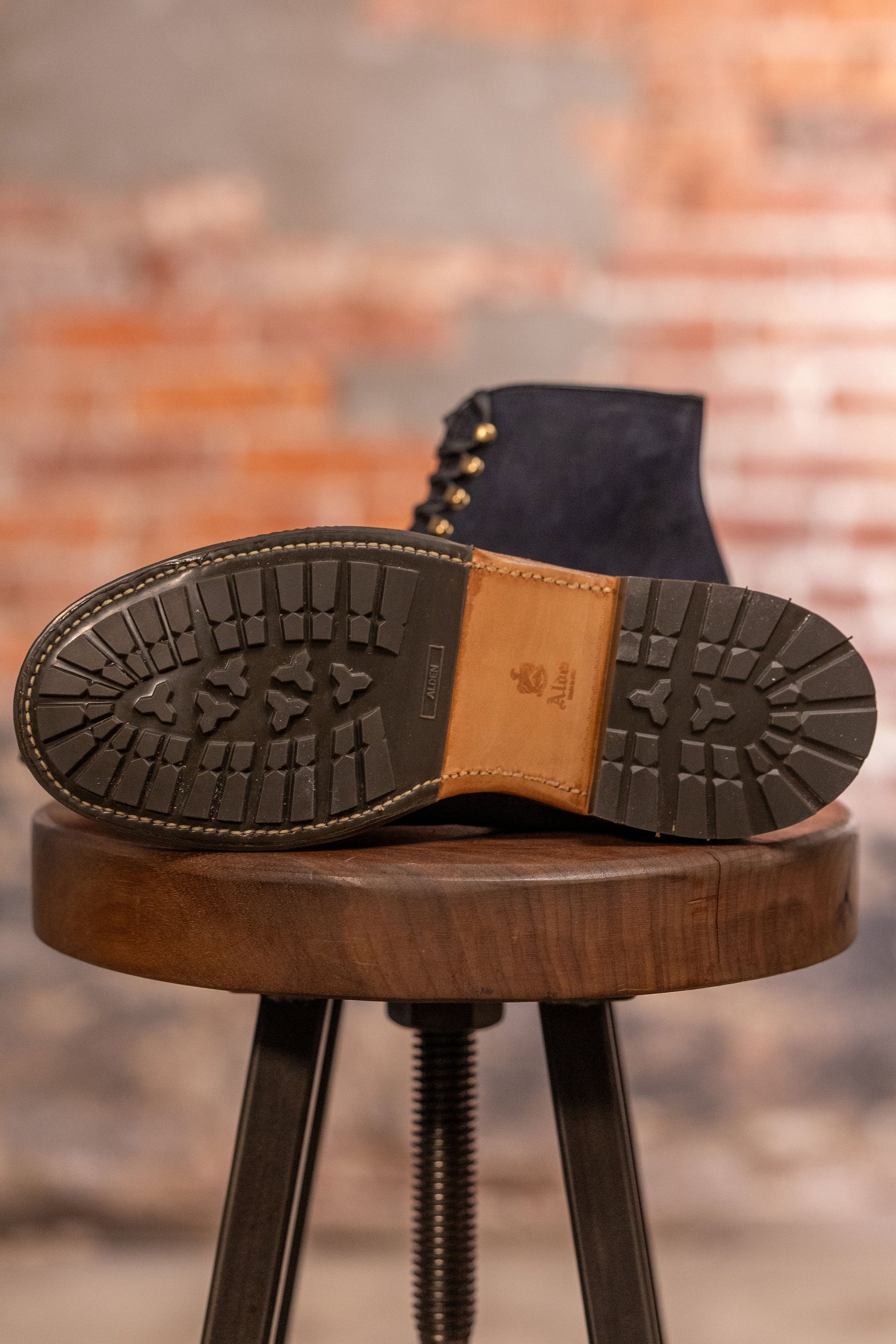 Navy blue suede cap toe boots view on traction on sole