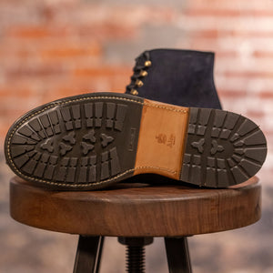 Navy blue suede cap toe boots view on traction on sole
