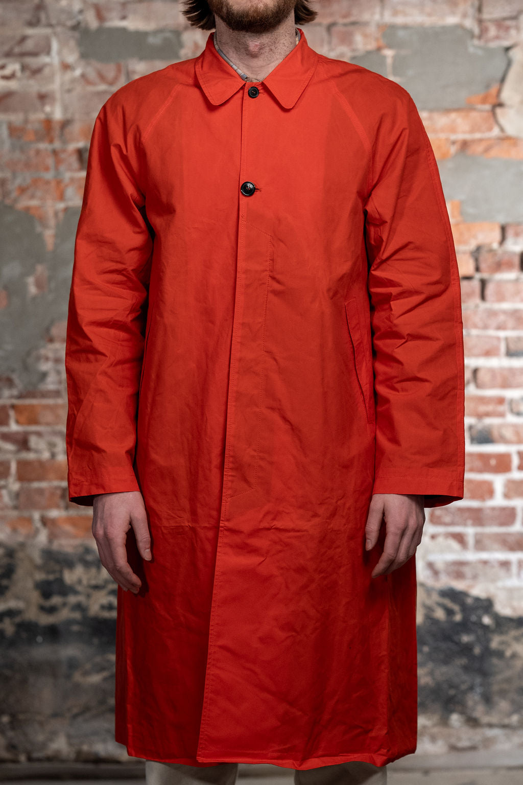 Hansen Garments Morten Long Coat - Waxed Orange on model from the front