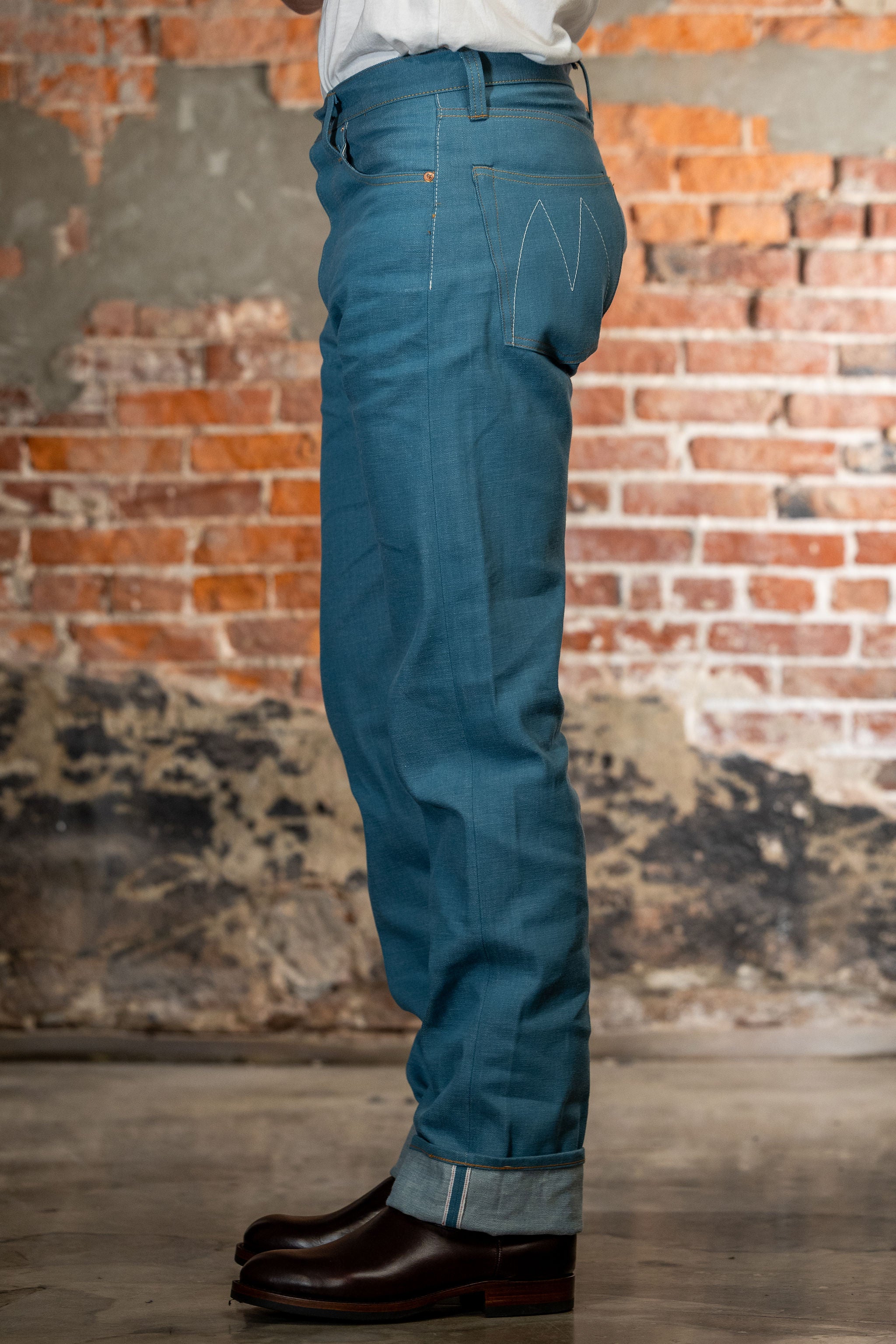 Light blue denim jeans straight cut side view on model