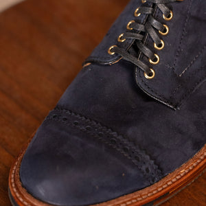 Navy blue suede cap toe boots close up on toe