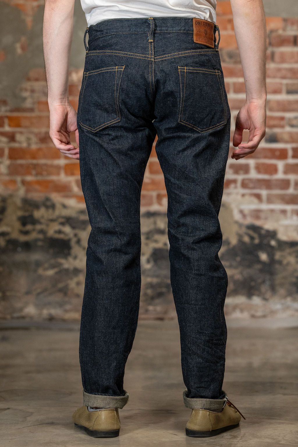 Rear view of the  Oni Denim 622-GC15 - 15oz Relaxed Tapered Green Cast Denim
