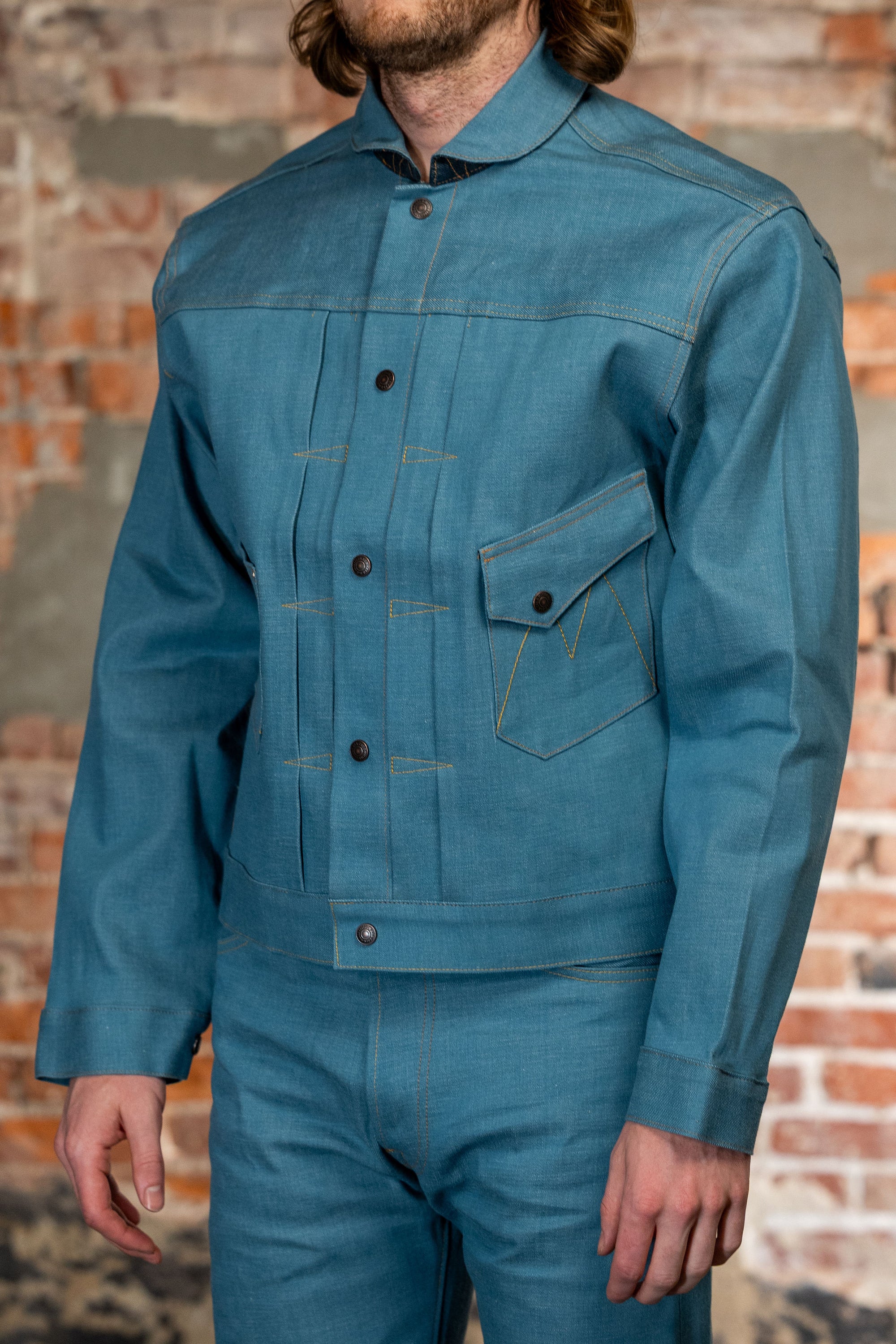 Light blue denim jacket side view on model