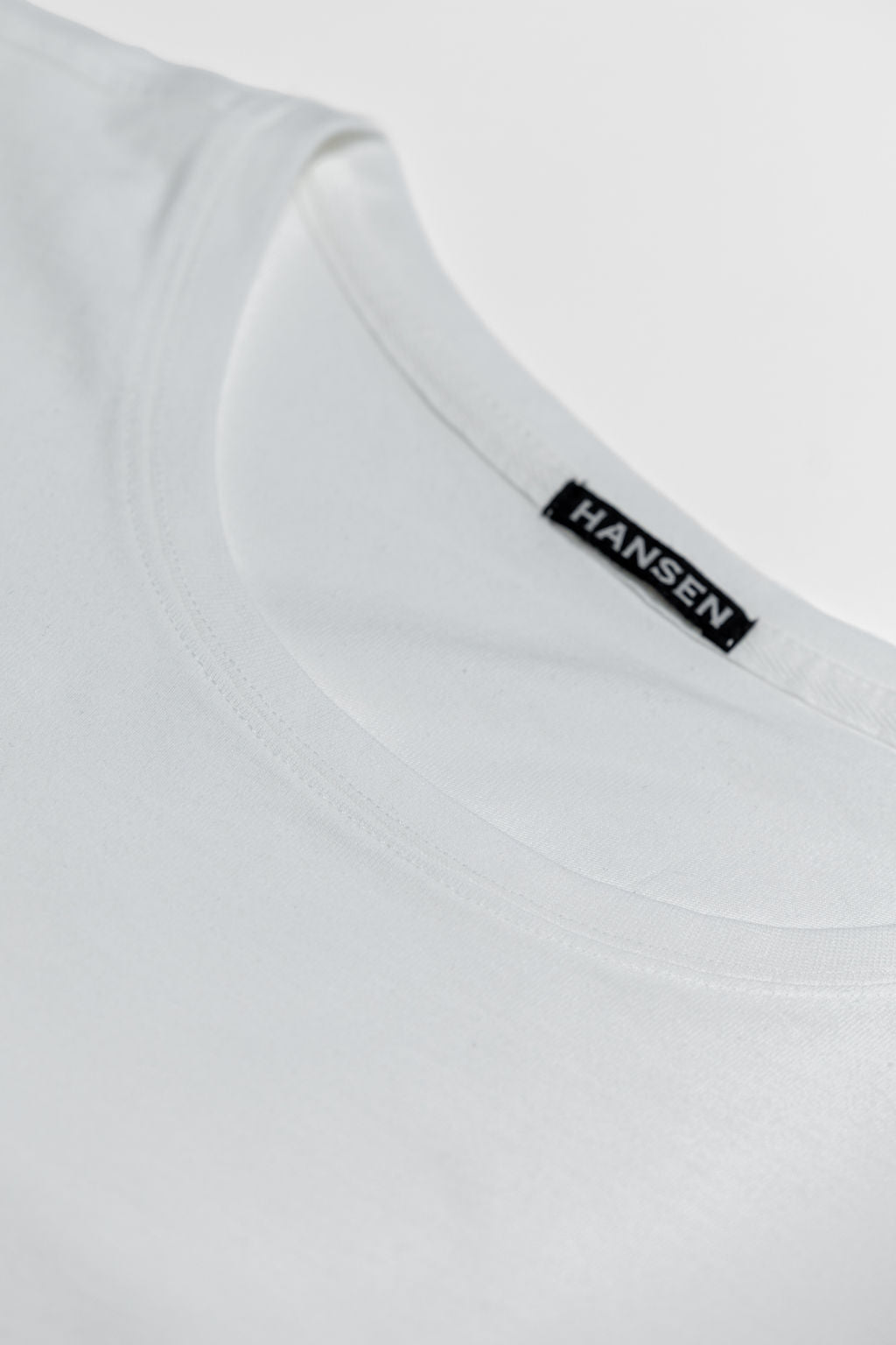 Hansen Garments Julian Crew Neck T-Shirt - White laid flat detail of neck stitching