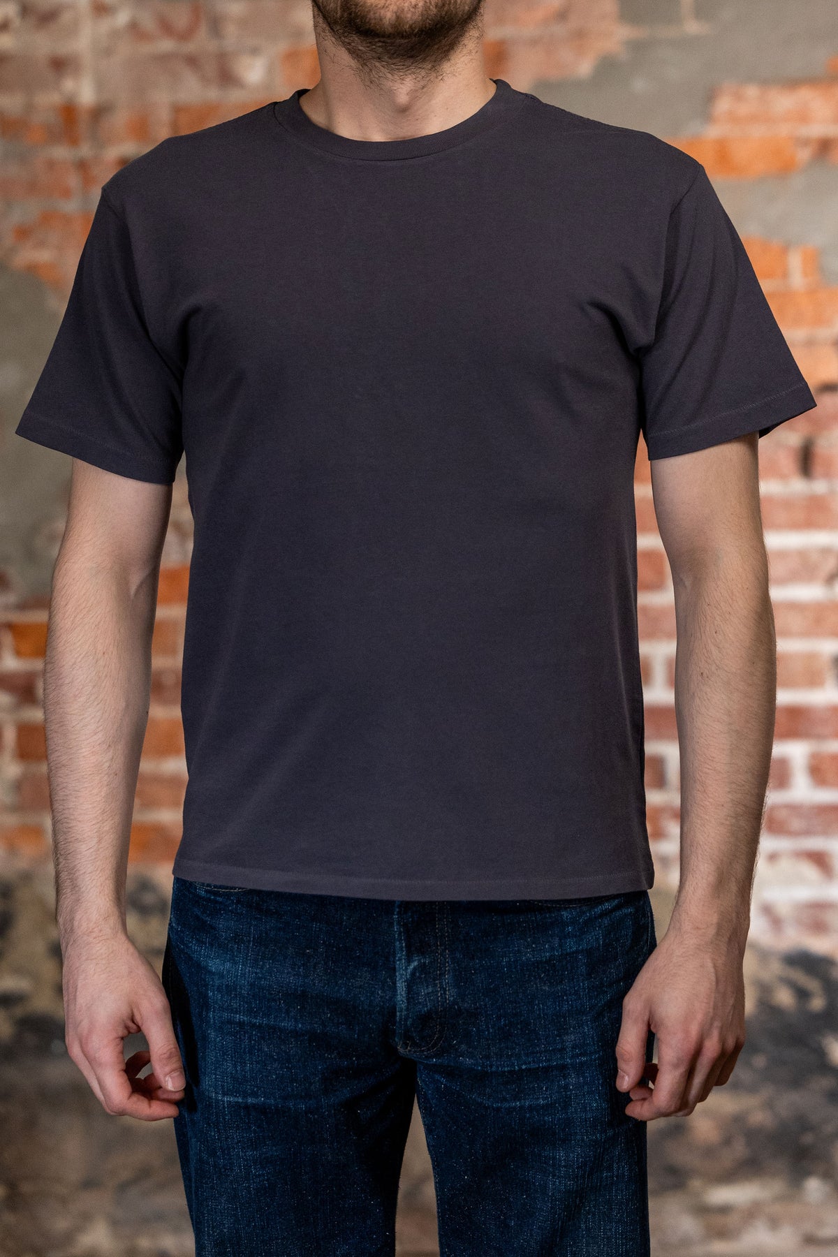Dark blue premium t-shirt front view on model