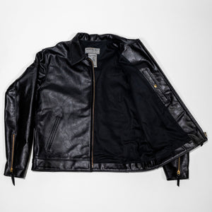 Black leather jacket laid flat on white. Shot from the front unzipped 