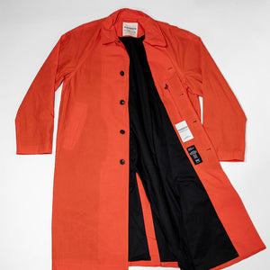 Hansen Garments Morten Long Coat - Waxed Orange laid flat unbuttoned 