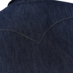 Dark indigo denim western-style shirt with white snaps, close up on back yoke laying flat