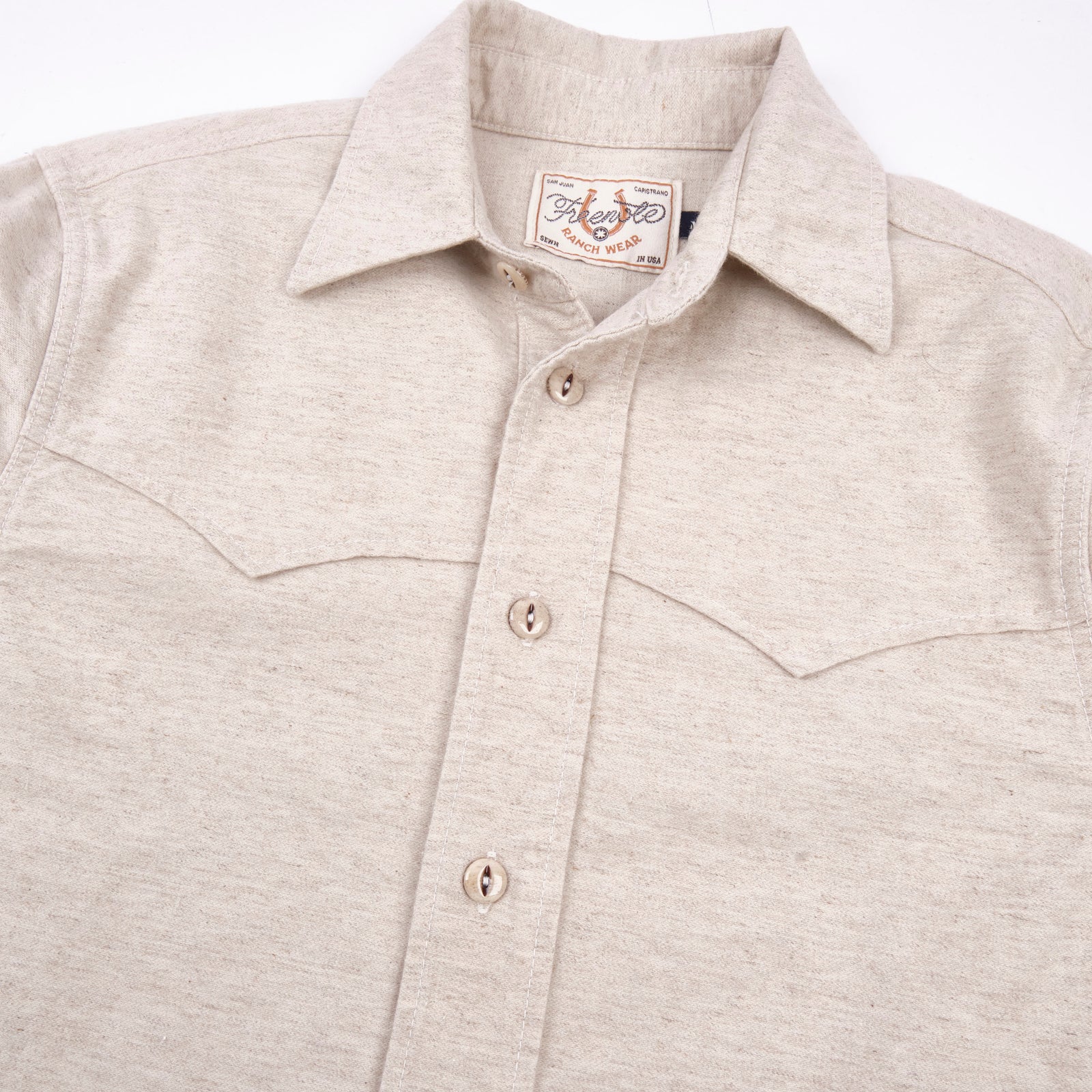 Freenote Cloth Huntsman - Natural Nep laid flat on white from the front details of buttons, and western style front yoke