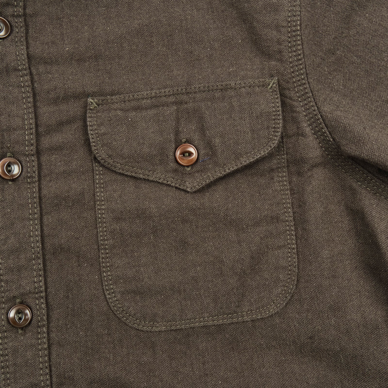 Wells shirt, laid flat left chest pocket details. 
