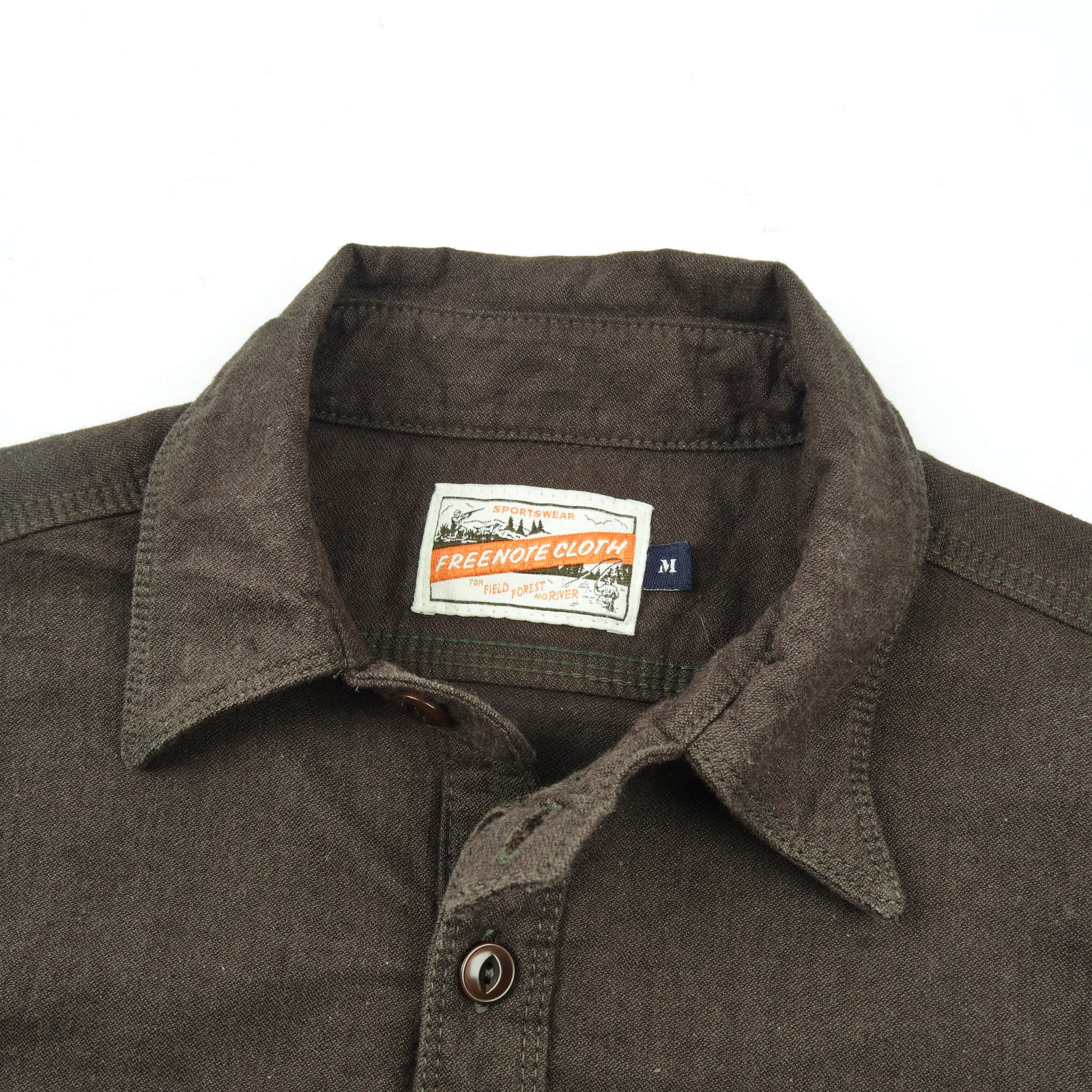 Wells shirt, laid flat on white close up on collar and top buttons