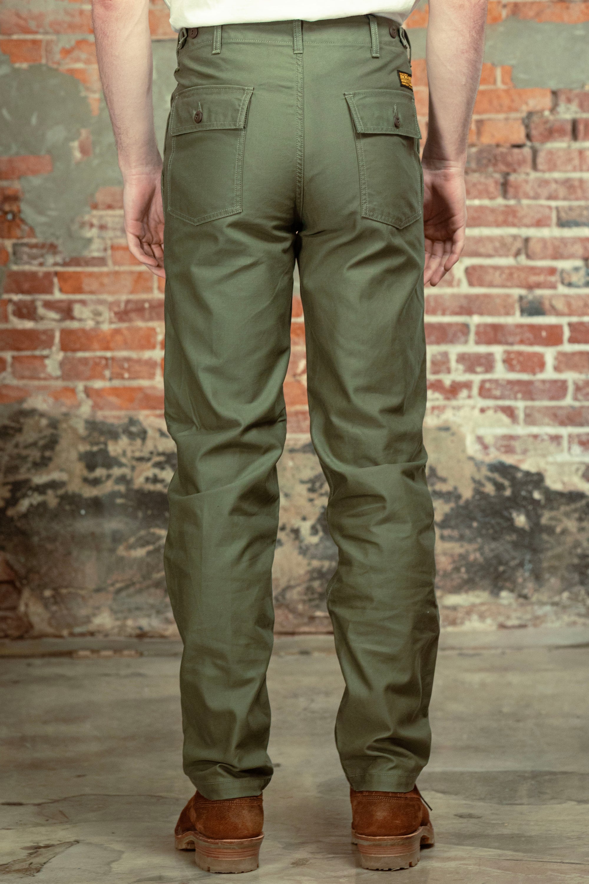 Olive fatigue pocket straight cut pants back view on model