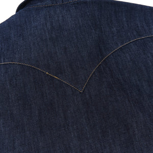Dark indigo denim western-style short sleeve shirt with white snaps, close up on back yoke laying flat