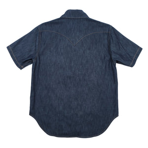Dark indigo denim western-style short sleeve shirt with white snaps, back view laying flat